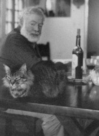 Hemingway and a small tiger. Hemingway started his career as a journalist.
