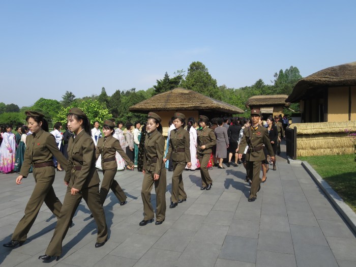 Women in military uniform - not an uncommon sight - at a tourist location.