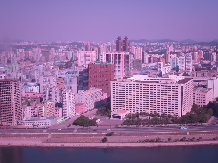 The view from my hotel (floor 39, room 19)  at the Yanggakdo International Hotel, in the capital Pyongyang. The colour tint is due to the fact I used my sunglasses as a filter for my camera to cut down on the haze. 